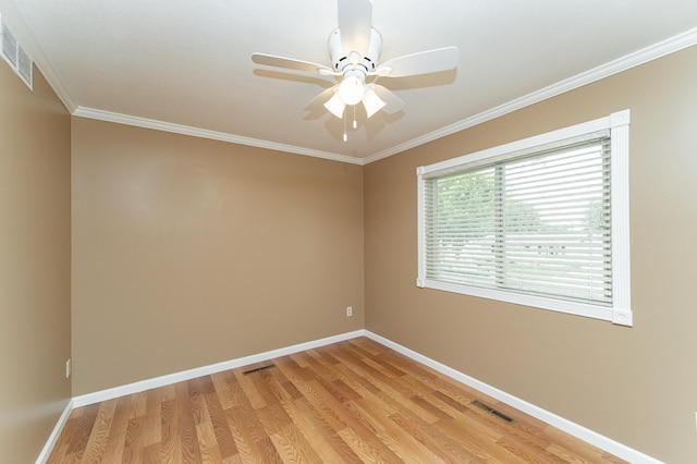222 6th Ave NW, Byron, MN 55920 - empty room with crown molding, light wood-style floors, baseboards, and a ceiling fan