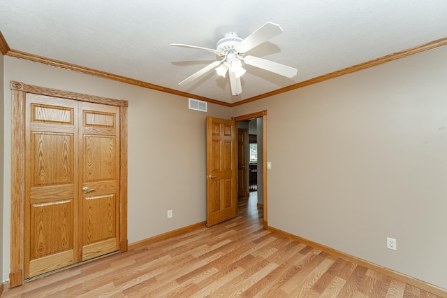 222 6th Ave NW, Byron, MN 55920 - unfurnished bedroom with light wood finished floors, baseboards, ornamental molding, and a ceiling fan