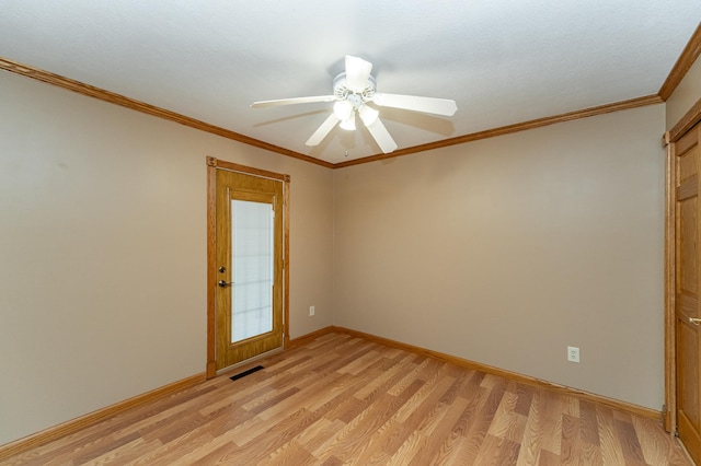 222 6th Ave NW, Byron, MN 55920 - spare room featuring light wood-style floors, baseboards, crown molding, and a ceiling fan