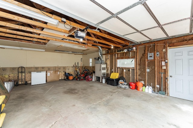 222 6th Ave NW, Byron, MN 55920 - garage featuring fridge and a garage door opener