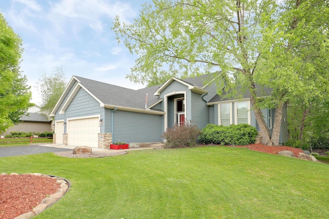 22669 128th Ave N, Rogers, MN 55374 - view of front facade with driveway, a front yard, a garage, and stone siding