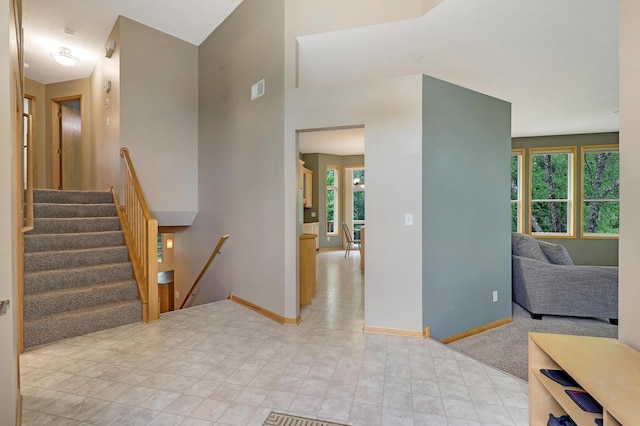 22669 128th Ave N, Rogers, MN 55374 - foyer with baseboards, healthy amount of natural light, and stairway