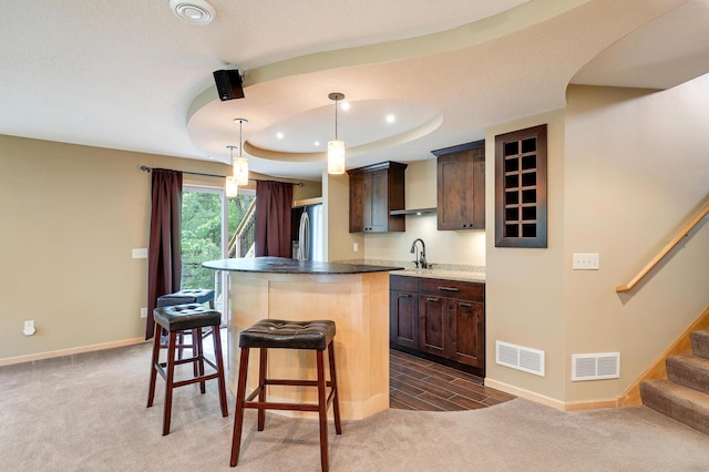 22669 128th Ave N, Rogers, MN 55374 - kitchen with stainless steel fridge, a sink, a center island, baseboards, and dark brown cabinetry