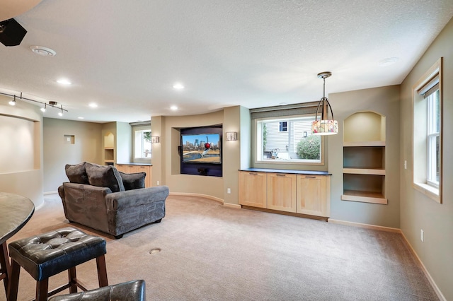 22669 128th Ave N, Rogers, MN 55374 - living room featuring light colored carpet, plenty of natural light, baseboards, a textured ceiling, and recessed lighting