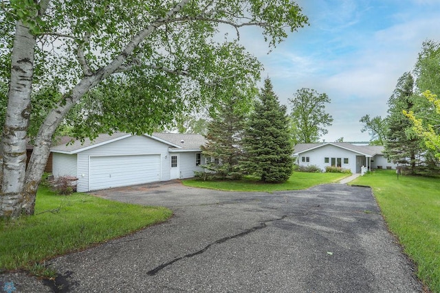 38682 Walker Lake Dr, Amor Twp, MN 56576 - ranch-style home with driveway, a front yard, and an attached garage