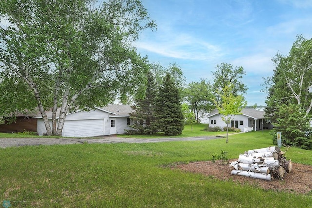 38682 Walker Lake Dr, Amor Twp, MN 56576 - view of grassy yard with driveway and an attached garage