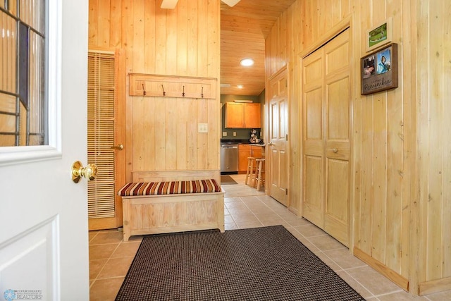 38682 Walker Lake Dr, Amor Twp, MN 56576 - corridor featuring light tile patterned flooring and wood walls