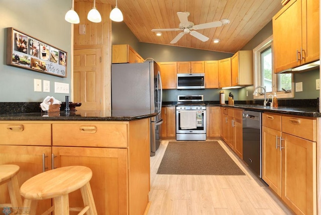38682 Walker Lake Dr, Amor Twp, MN 56576 - kitchen with stainless steel appliances, a sink, light wood-style flooring, a ceiling fan, and dark stone counters