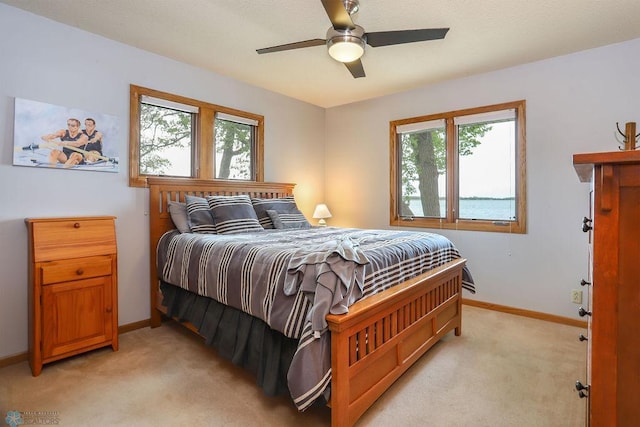 38682 Walker Lake Dr, Amor Twp, MN 56576 - bedroom featuring light carpet, baseboards, and a ceiling fan