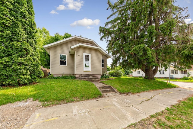 410 Spruce Ave NW, Montgomery, MN 56069 - bungalow-style house featuring a front yard