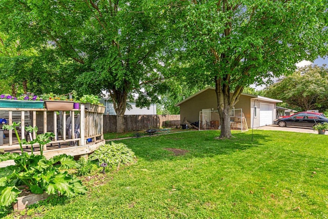 410 Spruce Ave NW, Montgomery, MN 56069 - view of yard with a deck and driveway