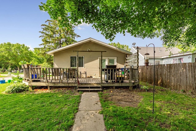 410 Spruce Ave NW, Montgomery, MN 56069 - rear view of house featuring a wooden deck