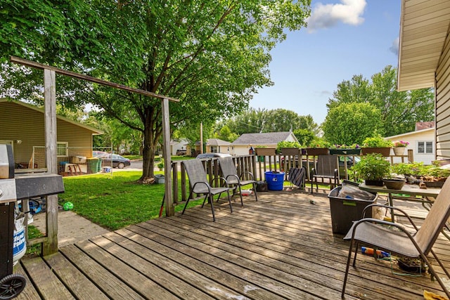 410 Spruce Ave NW, Montgomery, MN 56069 - wooden deck with a lawn