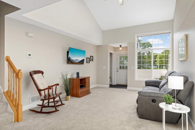 8783 Hastings Cir NE, Blaine, MN 55449 - living room featuring light carpet, baseboards, and vaulted ceiling