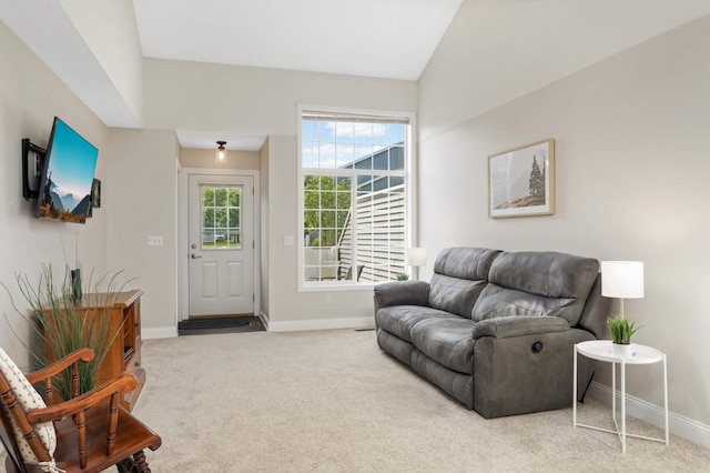 8783 Hastings Cir NE, Blaine, MN 55449 - carpeted living area featuring baseboards and lofted ceiling