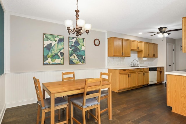 8783 Hastings Cir NE, Blaine, MN 55449 - dining room featuring a chandelier, dark wood-style flooring, a ceiling fan, wainscoting, and recessed lighting