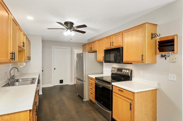 8783 Hastings Cir NE, Blaine, MN 55449 - kitchen featuring appliances with stainless steel finishes, ceiling fan, a sink, dark wood-style flooring, and light countertops