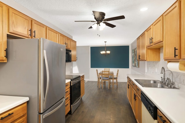 8783 Hastings Cir NE, Blaine, MN 55449 - kitchen featuring appliances with stainless steel finishes, a sink, a ceiling fan, light countertops, and dark wood-style flooring