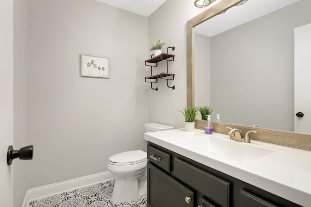 8783 Hastings Cir NE, Blaine, MN 55449 - bathroom featuring vanity, toilet, tile patterned flooring, and baseboards