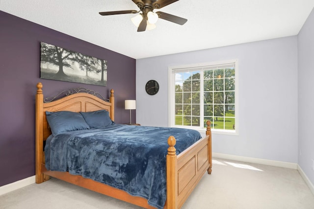 8783 Hastings Cir NE, Blaine, MN 55449 - bedroom with light colored carpet, baseboards, and a ceiling fan
