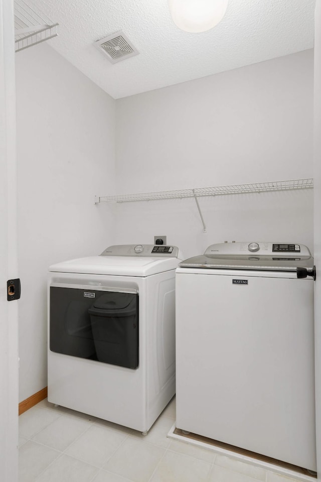 8783 Hastings Cir NE, Blaine, MN 55449 - laundry area with washer and clothes dryer and baseboards