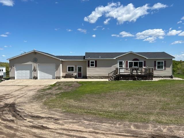 42626 County Highway 125, Perham Twp, MN 56573 - view of front of property with driveway, a garage, a front lawn, and a wooden deck