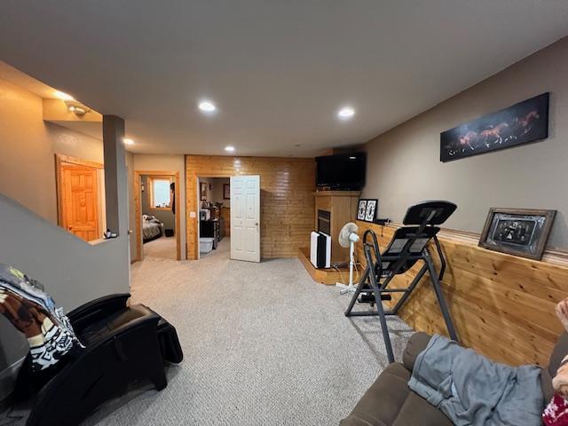42626 County Highway 125, Perham Twp, MN 56573 - workout area with recessed lighting, carpet floors, and a glass covered fireplace