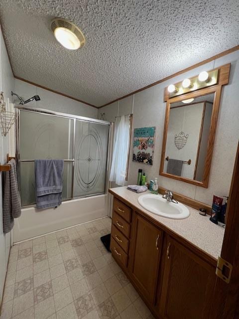 42626 County Highway 125, Perham Twp, MN 56573 - bathroom featuring a textured ceiling, crown molding, vanity, combined bath / shower with glass door, and tile patterned floors