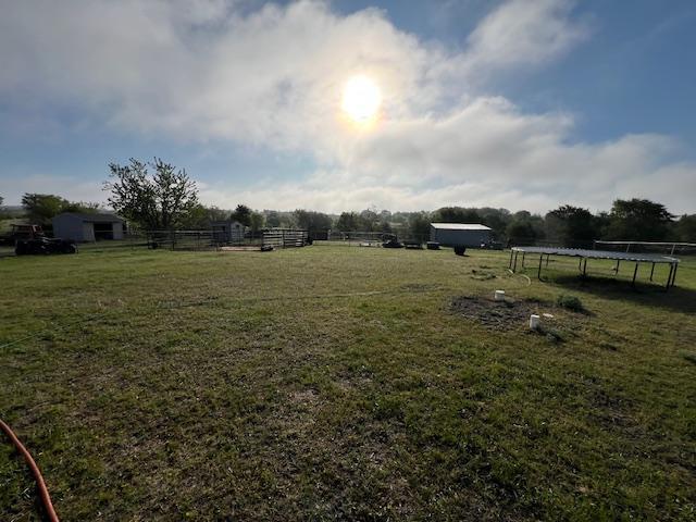 42626 County Highway 125, Perham Twp, MN 56573 - view of yard featuring a trampoline and a rural view