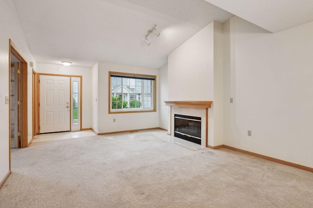 8733 Baxter Way Unit 47, Inver Grove Heights, MN 55076 - unfurnished living room featuring carpet flooring and a glass covered fireplace