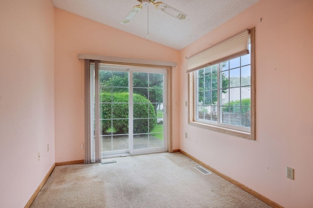 8733 Baxter Way Unit 47, Inver Grove Heights, MN 55076 - empty room featuring vaulted ceiling, carpet, and ceiling fan
