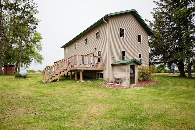 642 4th St, Turtle Lake, WI 54004 - rear view of property featuring a wooden deck, stairs, and a lawn