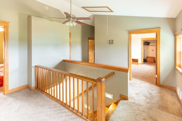 642 4th St, Turtle Lake, WI 54004 - hall featuring lofted ceiling, an upstairs landing, carpet, attic access, and baseboards
