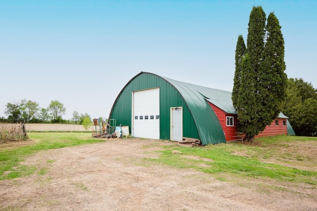 642 4th St, Turtle Lake, WI 54004 - detached garage featuring dirt driveway