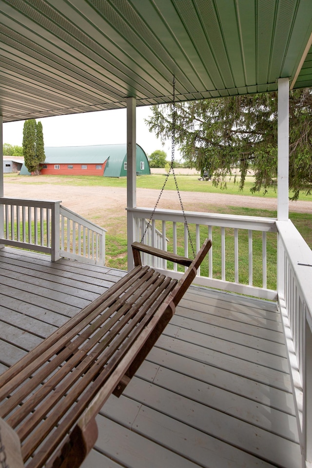 642 4th St, Turtle Lake, WI 54004 - wooden porch with a lawn