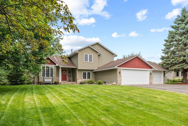 1279 146th Ln NW, Andover, MN 55304 - view of front facade featuring an attached garage, asphalt driveway, a front yard, and a shingled roof