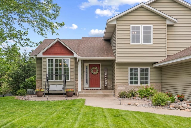1279 146th Ln NW, Andover, MN 55304 - view of front of home with a front lawn and a shingled roof