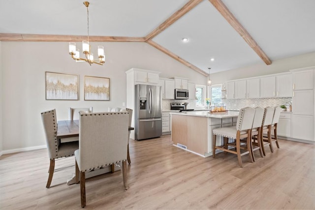 1279 146th Ln NW, Andover, MN 55304 - dining area featuring a chandelier and light wood-style floors