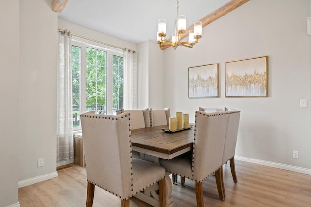 1279 146th Ln NW, Andover, MN 55304 - dining area featuring a chandelier, baseboards, and light wood finished floors