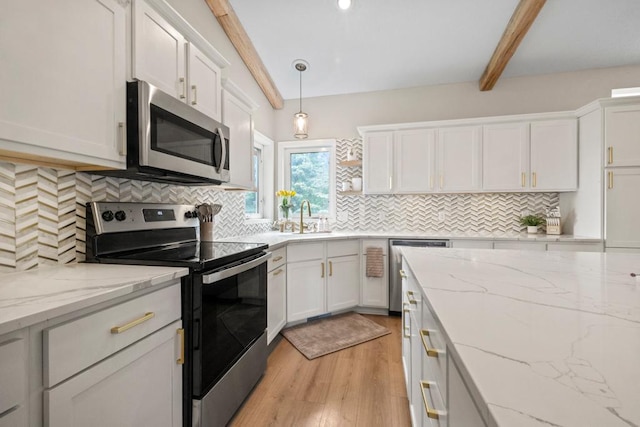 1279 146th Ln NW, Andover, MN 55304 - kitchen featuring appliances with stainless steel finishes, beamed ceiling, light wood-style flooring, and white cabinets