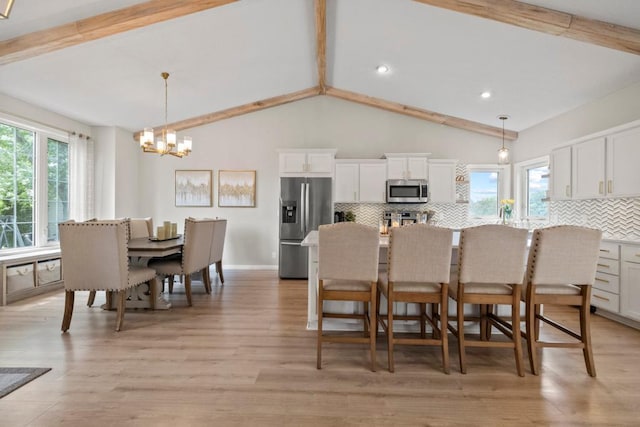 1279 146th Ln NW, Andover, MN 55304 - dining space featuring a chandelier, healthy amount of natural light, light wood-style flooring, and recessed lighting