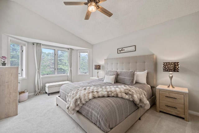 1279 146th Ln NW, Andover, MN 55304 - bedroom with light carpet, vaulted ceiling, baseboards, a textured ceiling, and a ceiling fan