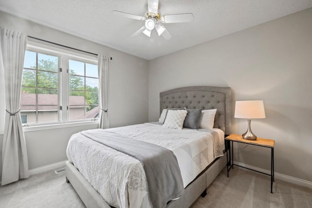 1279 146th Ln NW, Andover, MN 55304 - carpeted bedroom with baseboards, ceiling fan, and a textured ceiling