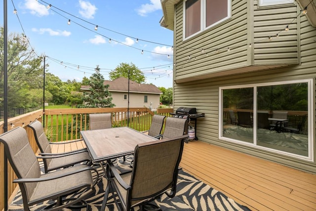 1279 146th Ln NW, Andover, MN 55304 - wooden terrace featuring outdoor dining area and a grill
