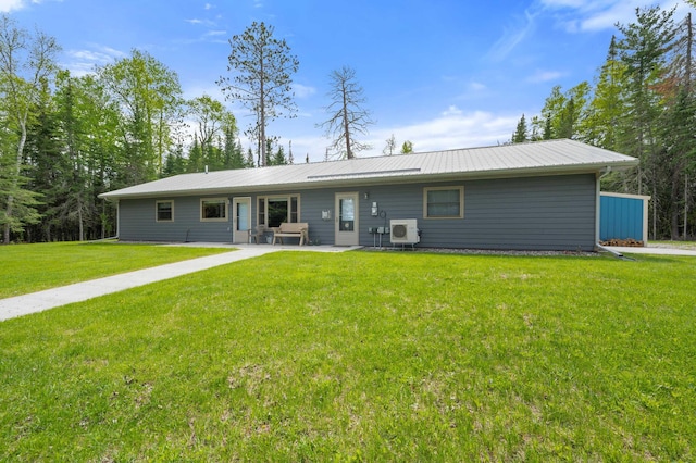 52852 Brush Shanty Lake Rd, Bigfork, MN 56628 - back of property with a yard, metal roof, and a patio