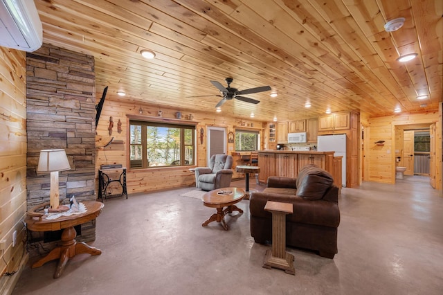 52852 Brush Shanty Lake Rd, Bigfork, MN 56628 - living room with finished concrete floors, wooden ceiling, an AC wall unit, wooden walls, and recessed lighting