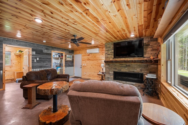 52852 Brush Shanty Lake Rd, Bigfork, MN 56628 - living room with an AC wall unit, wooden ceiling, a fireplace, recessed lighting, and a ceiling fan