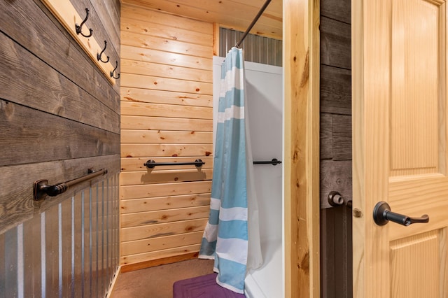 52852 Brush Shanty Lake Rd, Bigfork, MN 56628 - bathroom featuring a shower with curtain and wood walls