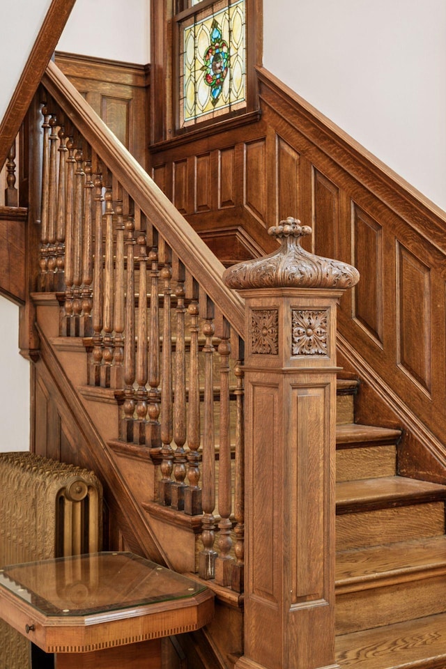 776 Summit Ave, Saint Paul, MN 55105 - stairway featuring wainscoting and a decorative wall