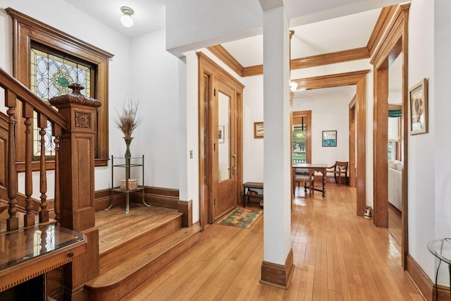776 Summit Ave, Saint Paul, MN 55105 - entryway featuring stairway, light wood-type flooring, and crown molding